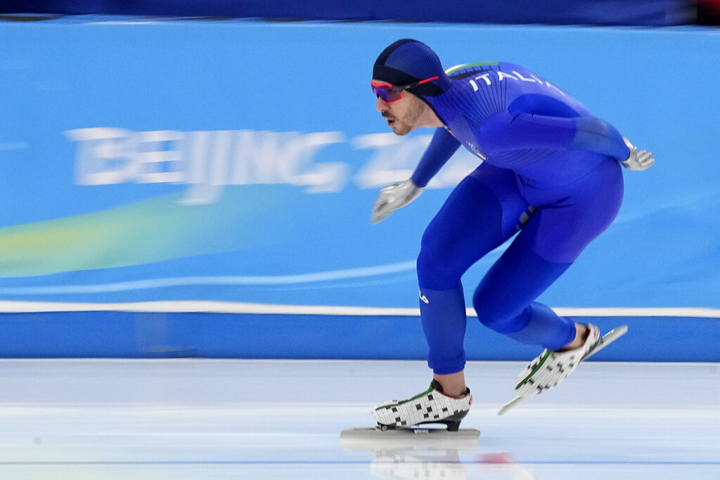 Davide Ghiotto of Italy competes in the men's speedskating 10,000-meter race at the 2022 Winter Olympics, Friday, Feb. 11, 2022, in Beijing. (AP Photo/Sue Ogrocki)