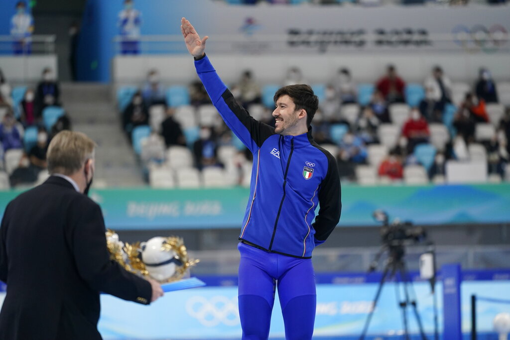Bronze medalist Davide Ghiotto of Italy reacts during a venue ceremony for the men's speedskating 10,000-meter race at the 2022 Winter Olympics, Friday, Feb. 11, 2022, in Beijing. (AP Photo/Ashley Landis)