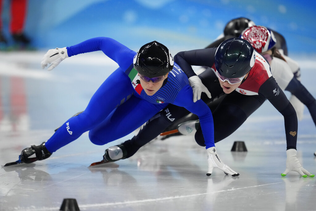 Arianna Fontana of Italy, and Xandra Velzeboer of the Netherlands, race in their semifinal of the women's 1000-meters during the short track speedskating competition at the 2022 Winter Olympics, Friday, Feb. 11, 2022, in Beijing. (AP Photo/Natacha Pisarenko)