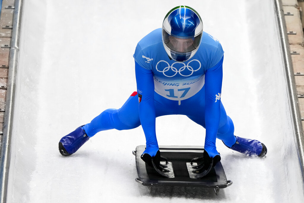 Mattia Gaspari, of Italy, finishes the men's skeleton run 3 at the 2022 Winter Olympics, Friday, Feb. 11, 2022, in the Yanqing district of Beijing. (AP Photo/Dmitri Lovetsky)