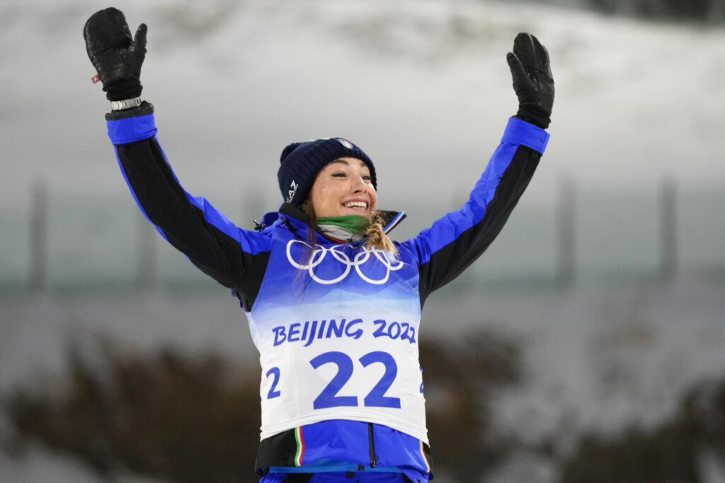 Dorothea Wierer of Italy celebrates during a venue ceremony after the women's 7.5-kilometer sprint competition at the 2022 Winter Olympics, Friday, Feb. 11, 2022, in Zhangjiakou, China. (AP Photo/Frank Augstein)