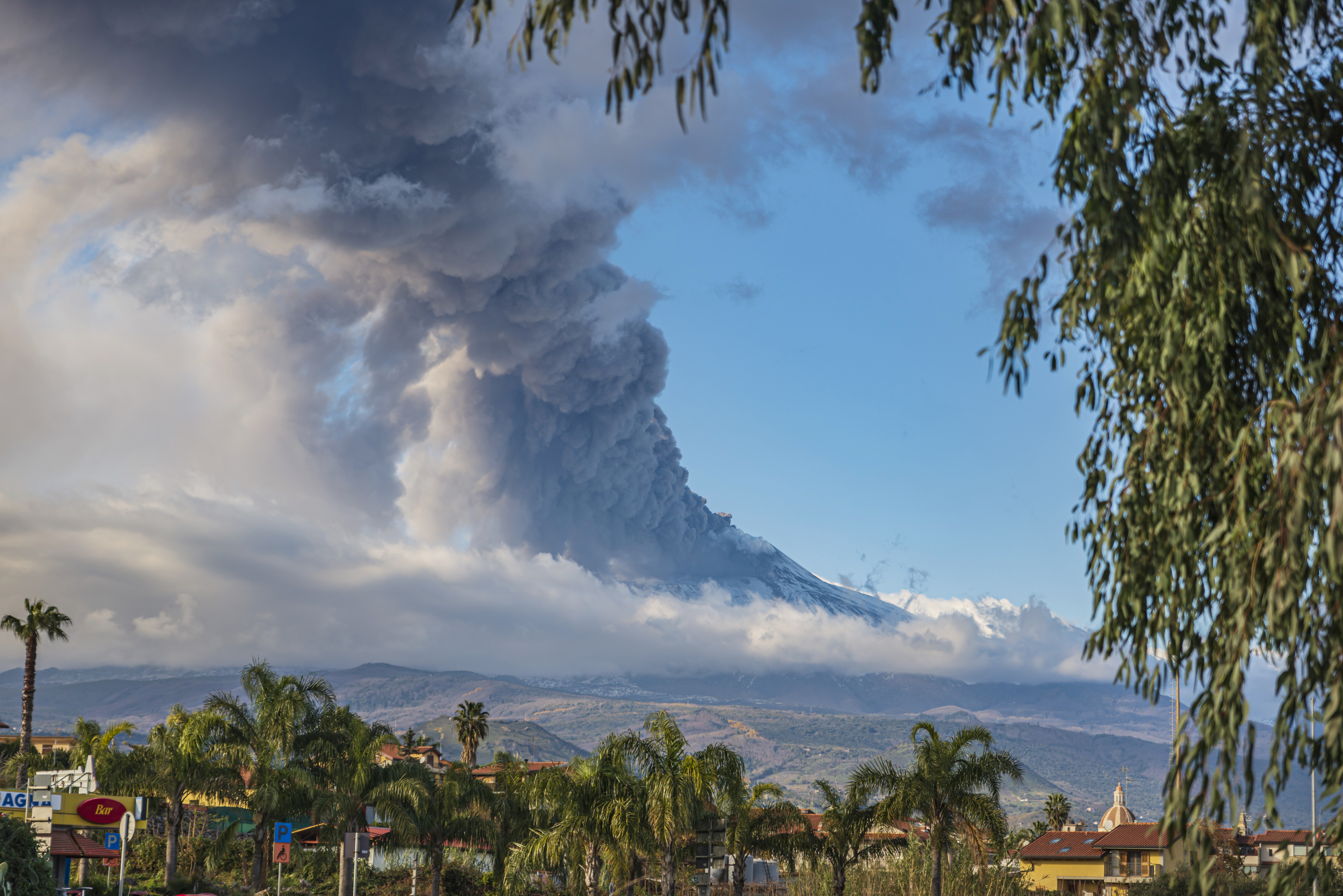 Mount Etna erupts viewed from Acireale near Catania, in southern Italy, on Tuesday, Dec. 14, 2021. (AP Photo/Salvatore Allegra)