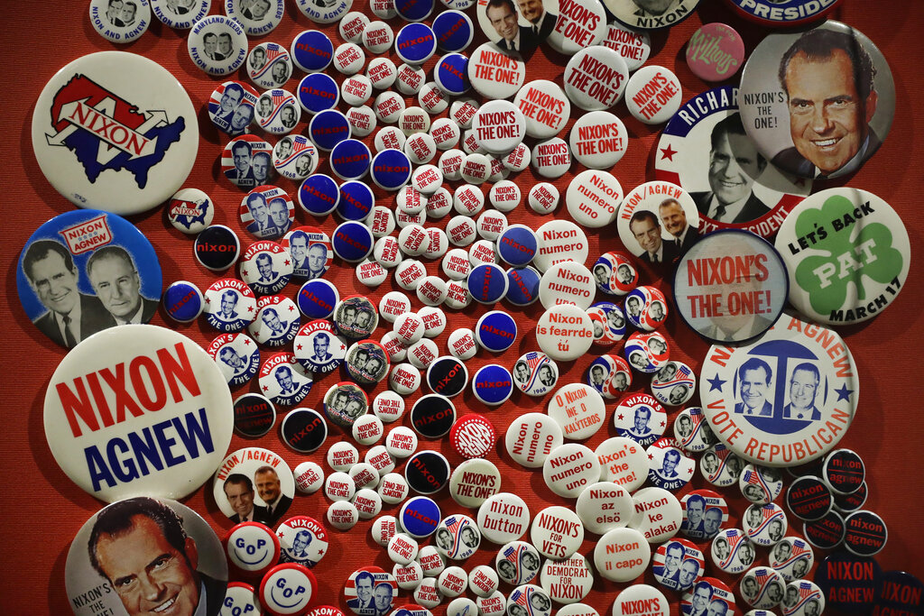 In this Wednesday, Oct. 5, 2016 photo, campaign buttons are on display in the museum at the Richard Nixon Presidential Library and Museum in Yorba Linda, Calif. The museum will reopen Friday, Oct. 14, following a $15 million makeover aimed at bringing the country’s 37th president closer to younger generations less familiar with his groundbreaking trip to China or the Watergate scandal. (AP Photo/Jae C. Hong)