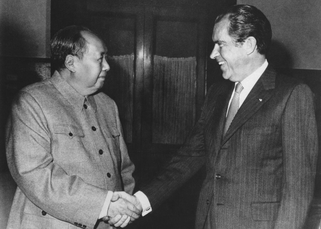 FILE - In this Feb. 21, 1972, file photo, Chinese communist party leader Mao Zedong, left, and U.S. President Richard Nixon shake hands as they meet in Beijing, China. Tossed into the middle of a potential thawing in U.S. relations with China, Judy Bochenski and her American ping pong teammates helped deliver one of the great diplomatic coups of their time. Their hastily arranged trip for exhibitions in three Chinese cities helped part the Red Curtain and open the way to a new world order that included China. It worked so well that President Richard Nixon would get on Air Force One the next year to make a state visit to China that enthralled the world.(AP Photo/File)