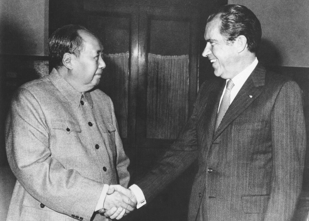 FILE - Then Chinese communist party leader Mao Zedong, left, and then U.S. President Richard Nixon shake hands as they meet in Beijing on Feb. 21, 1972. At the height of the Cold War, U.S. President Richard Nixon flew into communist China's center of power for a visit that over time would transform U.S.-China relations and China's position in the world in ways that were unimaginable at the time. (AP Photo, File)