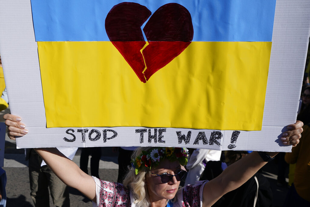 A Ukrainian protester joins a demonstration against the Russian invasion of Ukraine in Santa Monica, Calif., on Sunday, Feb. 27, 2022. Ukrainians in the United States are praying for friends and family, donating money and supplies, and attending demonstrations. (AP Photo/Damian Dovarganes)