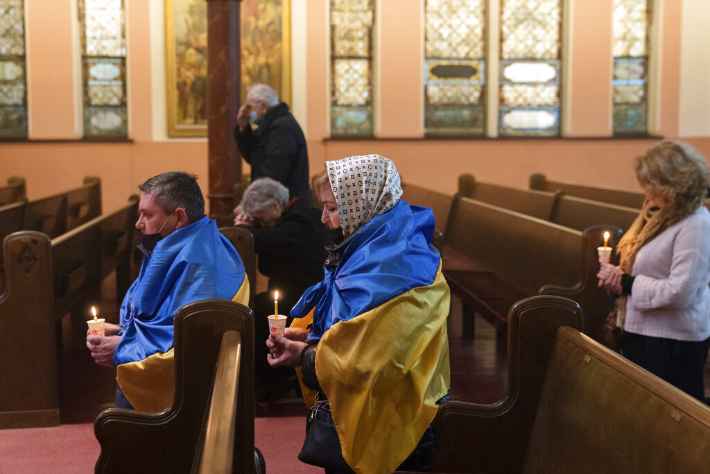 People pray during a service for Ukraine at Ukrainian Autocephalic Orthodox Church of St. Volodimir, Sunday, Feb. 27, 2022, in New York. (AP Photo/Jeenah Moon)