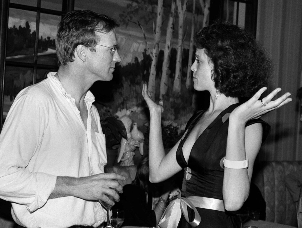 Actor William Hurt, left, and actress Sigourney Weaver talk during a celebration party at La Reserve in New York, August 8, 1984. The party kicked off the first Broadway performance of "Hurlyburly" at the Ethel Barrymore Theater. (AP Photo/Nancy Kaye)