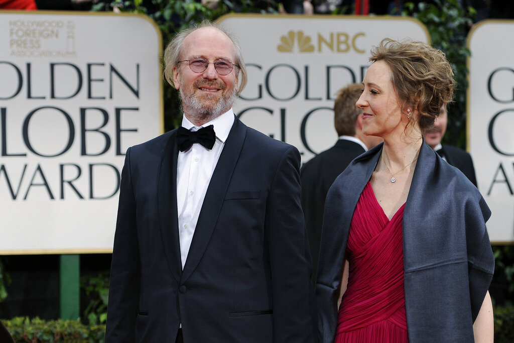FILE - William Hurt and Heidi Henderson arrive at the 69th Annual Golden Globe Awards Sunday, Jan. 15, 2012, in Los Angeles. Hurt, the Oscar-winning actor of “Broadcast News,” “Body Heat” and “The Big Chill,” has died. He was 71. Hurt's son, Will, said in a statement that Hurt died Sunday, March 13, 2022 of natural causes. (AP Photo/Chris Pizzello, File)