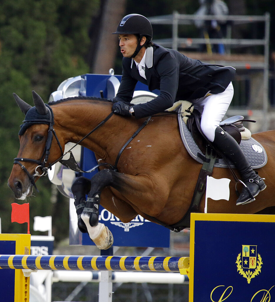 Switzerland's Steve Guerdat on Corbinian, competes during the Grand Prix Rome competition at the Rome Grand Prix International Horse Show, Sunday, May 24, 2015. (AP Photo/Gregorio Borgia)