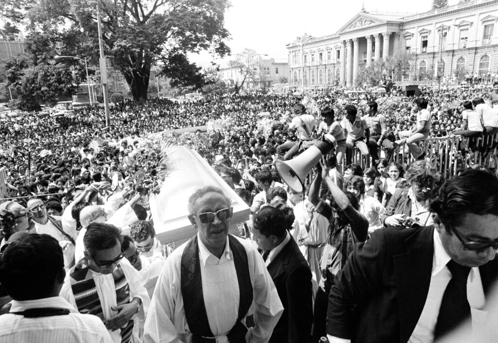 Thousands gather outside the Metropolitan Cathedral in San Salvador as the casket of slain Monsignor Oscar Arnulfo Romero is carried into the church for funeral services, March 26, 1980.  The Catholic archbishop was slain as he officiated at a Mass at a San Salvador hospital.  (AP Photo/Valente Cotera)