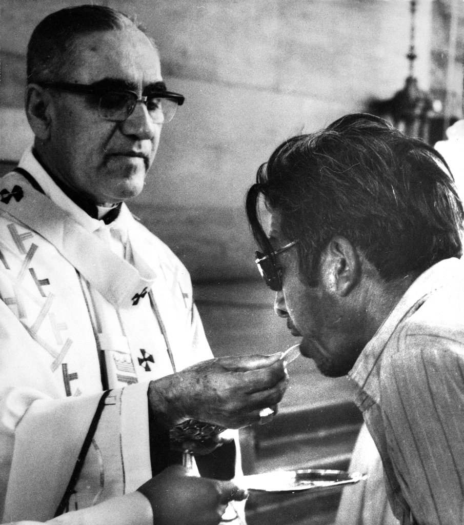 FILE - Archbishop Oscar Arnulfo-Romero offers the host wafer during the communion rite to a member of the congregation during a church mass in San Salvador, El Salvador on Jan. 13, 1980. Pope Francis has cleared the way for slain Salvadoran Archbishop Oscar Romero to be made a saint, declaring that a churchman who stood up for the poorest of the poor in the face of right-wing oppression should be a model for Catholics today. (AP Photo/Cotera, file)