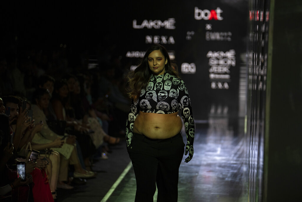 A model displays a creation by boAT X HUEMN during 'FDCI X Lakme Fashion Week' in in New Delhi, India, Friday, March 25, 2022. (AP Photo/Altaf Qadri)