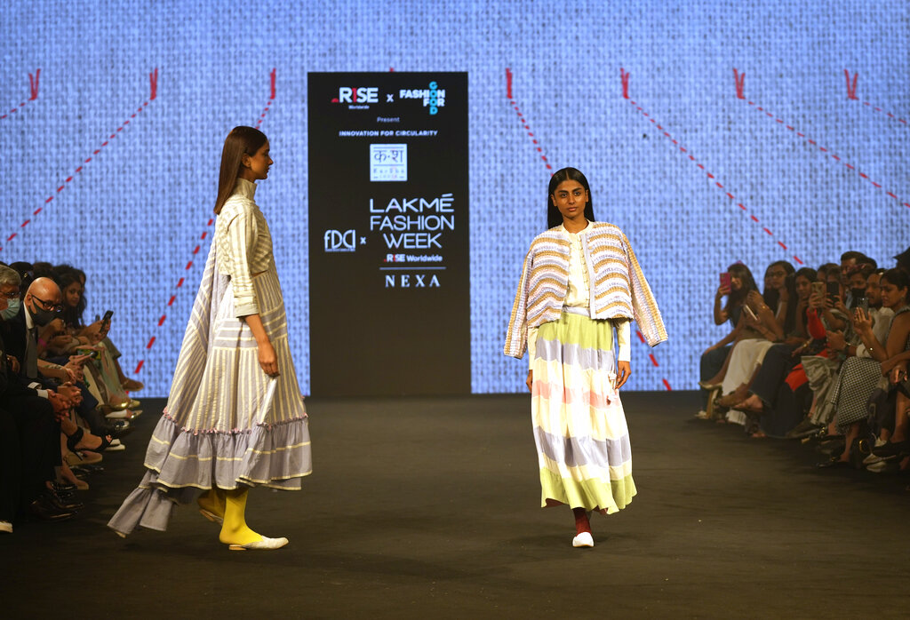 A model displays a creation by Indian designer Kasha during 'FDCI X Lakme Fashion Week' in New Delhi, Thursday, March 24, 2022. (AP Photo/Manish Swarup)