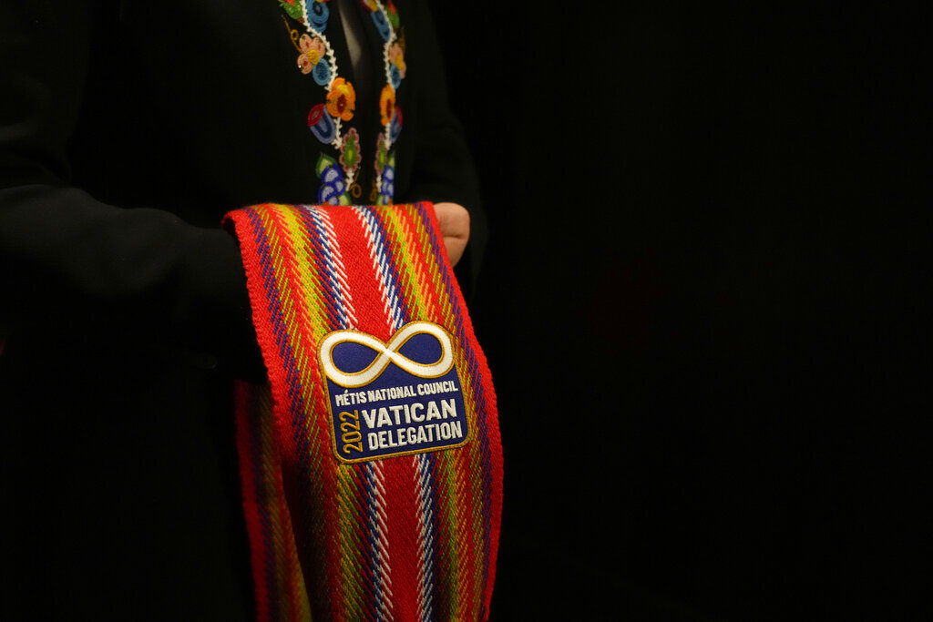 The President of the Metis community, Cassidy Caron shows a scarf she will wear with a meeting with Pope Francis in Rome, Monday, March 28, 2022. A Canadian indigenous delegations is scheduled to have a week of meetings with Pope Francis at the Vatican. (AP Photo/Gregorio Borgia)