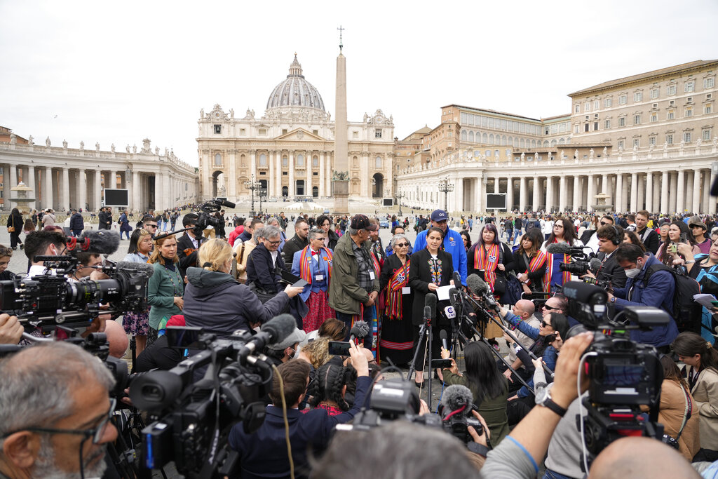 President of the Metis community, Cassidy Caron, center, speaks to the media in St. Peter's Square after their meeting with Pope Francis at The Vatican, Monday, March 28, 2022. (AP Photo/Gregorio Borgia)