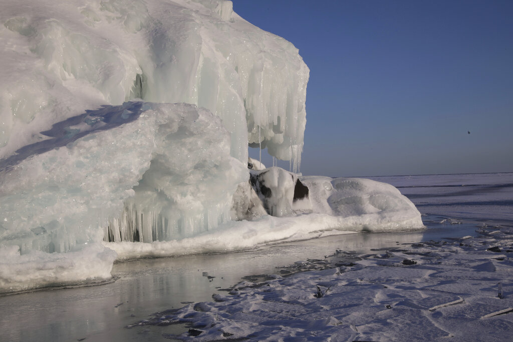 A frozen Hollow Rock sits on Lake Superior in Grand Portage, Minn. on March 3, 2022. (AP Photo/Emma H. Tobin)