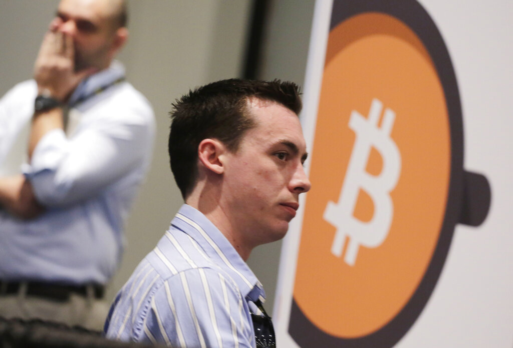 Curtis Fenimore, founder of Bitcoin Bigfoot, attends the Inside Bitcoins conference and trade show, Monday, April 7, 2014 in New York. Bitcoin Bigfoot, based in Wilmington, NC, provides promotional and marketing strategy for bitcoin companies. (AP Photo/Mark Lennihan)