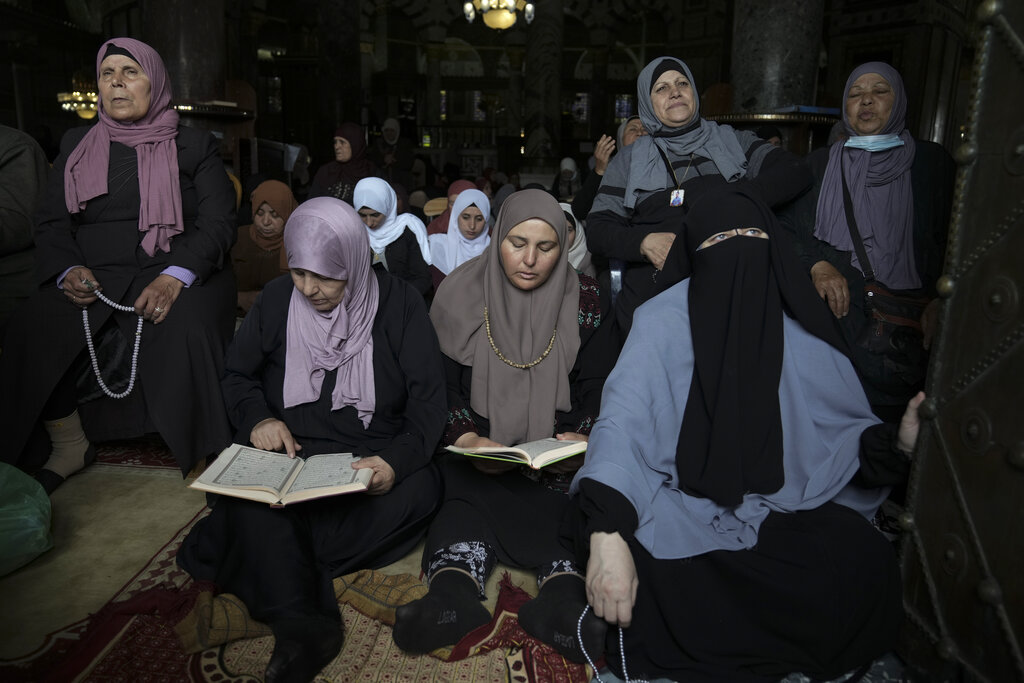Palestinian women pray during holy Islamic month of Ramadan at the al-Aqsa mosque compound in Jerusalem, Friday, April 8, 2022. (AP Photo/Mahmoud Illean)