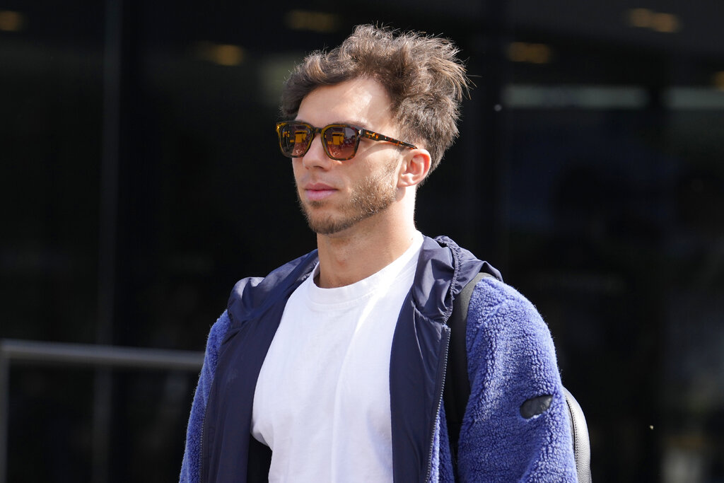 AlphaTauri driver Pierre Gasly of France arrives in the paddock at the Enzo and Dino Ferrari racetrack, in Imola, Italy, Saturday, April 23, 2022. Italy's Emila Romagna Formula One Grand Prix will take place on Sunday. (AP Photo/Luca Bruno).