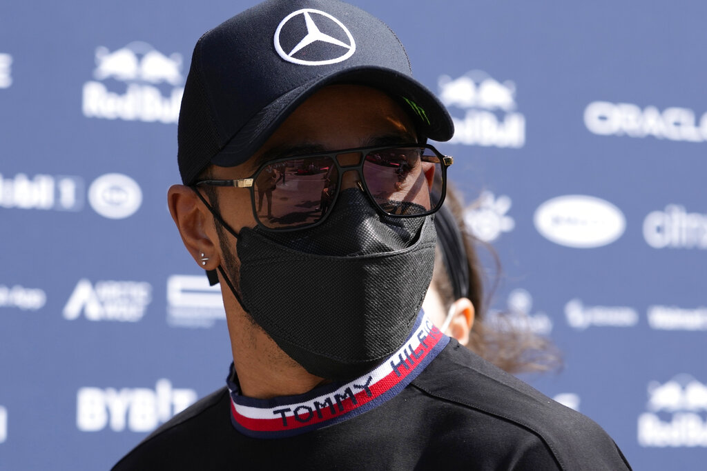 Mercedes driver Lewis Hamilton of Britain arrives in the paddock at the Enzo and Dino Ferrari racetrack, in Imola, Italy, Saturday, April 23, 2022. Italy's Emila Romagna Formula One Grand Prix will take place on Sunday. (AP Photo/Luca Bruno).