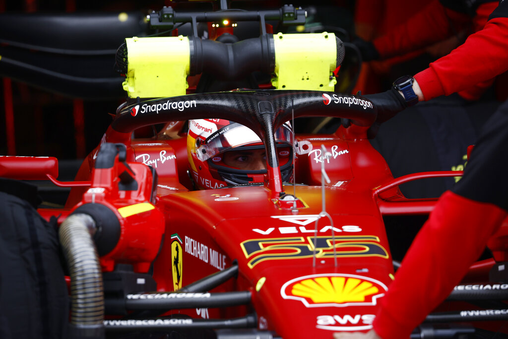 Ferrari driver Carlos Sainz of Spain sits in his car during the qualifying session for Sunday's Emilia Romagna Formula One Grand Prix, at the Dino and Enzo Ferrari racetrack in Imola, Italy, Friday, April 22, 2022. (Guglielmo Mangiapane, Pool via AP)