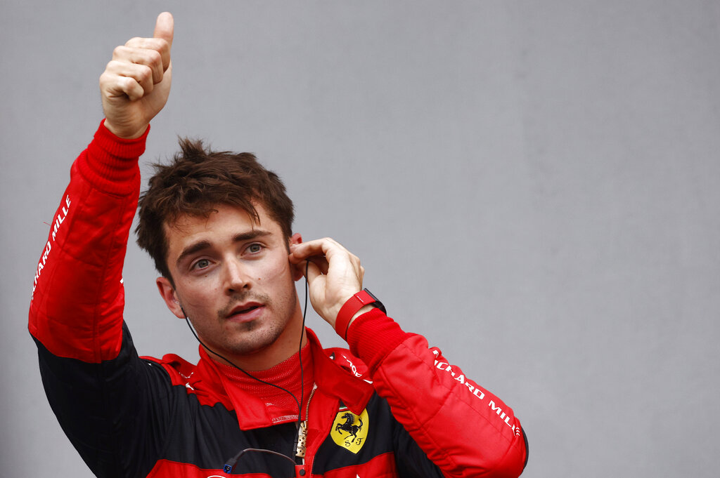 Ferrari driver Charles Leclerc of Monaco waves his fans after clocking a second fastest time during the qualifying session for Sunday's Emilia Romagna Formula One Grand Prix, at the Dino and Enzo Ferrari racetrack in Imola, Italy, Friday, April 22, 2022. (Guglielmo Mangiapane, Pool via AP)