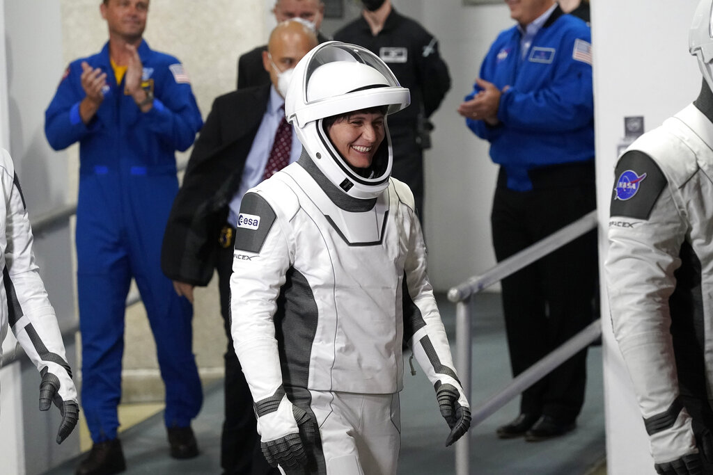 European Space Agency astronaut Samantha Cristoforetti, of Italy, smiles as she leaves the Operations and Checkout Building with fellow crew members Wednesday, April 27, 2022, at the Kennedy Space Center in Cape Canaveral, Fla. Four astronauts will fly on SpaceX's Crew-4 mission to the International Space Station. (AP Photo/John Raoux)