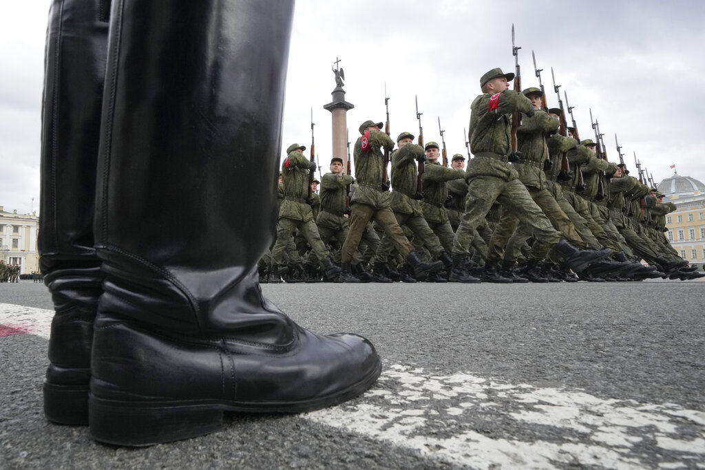 Troops march during a rehearsal for the Victory Day military parade which will take place at Dvortsovaya (Palace) Square on May 9 to celebrate 77 years after the victory in World War II in St. Petersburg, Russia, Tuesday, April 26, 2022. (AP Photo/Dmitri Lovetsky)