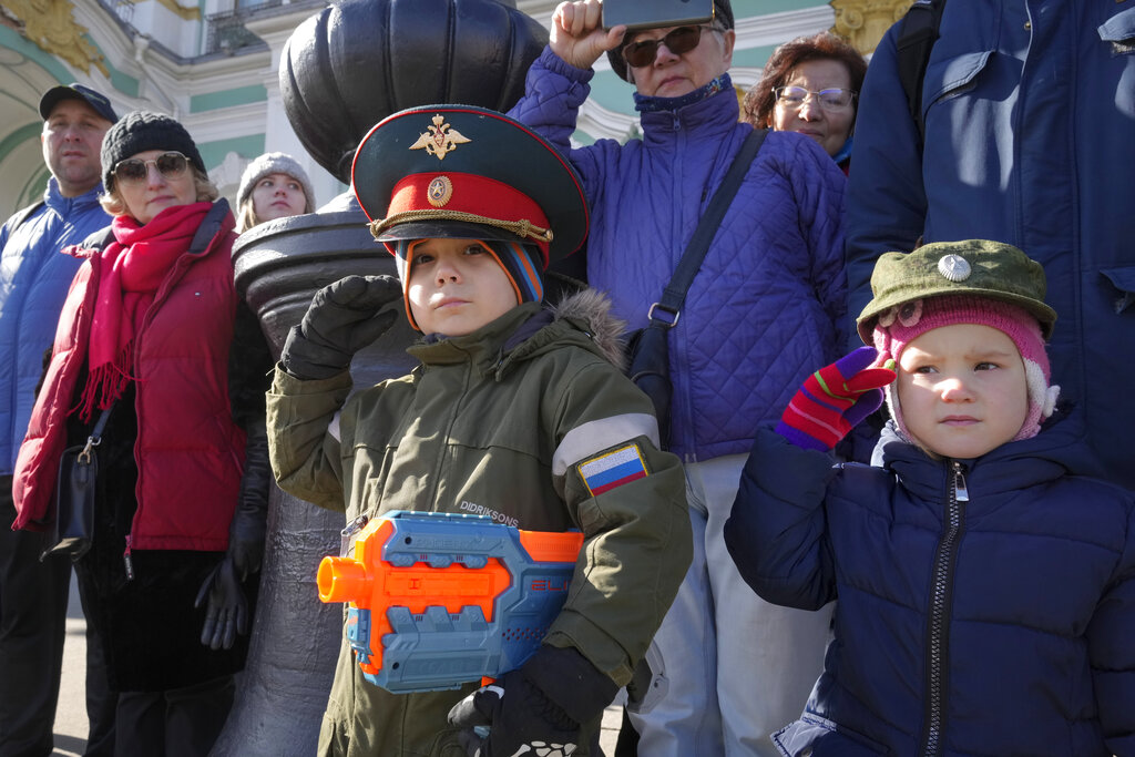 Boys salute during a rehearsal for the Victory Day military parade which will take place at Dvortsovaya (Palace) Square on May 9 to celebrate 77 years after the victory in World War II in St. Petersburg, Russia, Thursday, April 28, 2022. (AP Photo/Dmitri Lovetsky)
