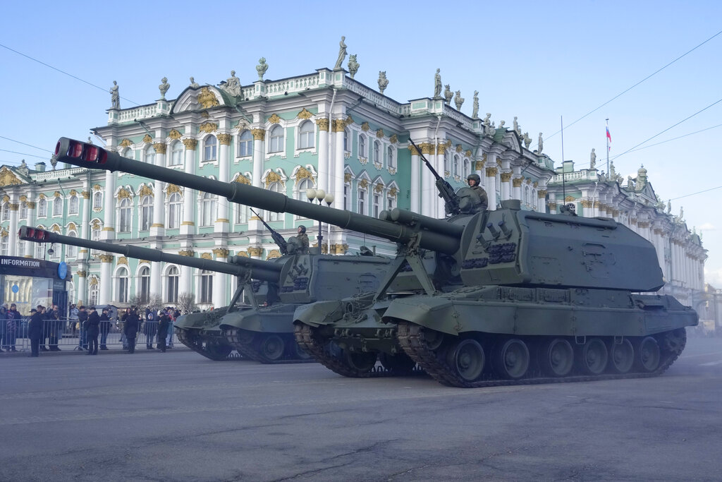 Self-propelled artillery vehicles Msta-S drive past the Winter Palace, the part of the State Hermitage museum during a rehearsal for the Victory Day military parade which will take place at Dvortsovaya (Palace) Square on May 9 to celebrate 77 years after the victory in World War II in St. Petersburg, Russia, Thursday, April 28, 2022. (AP Photo/Dmitri Lovetsky)