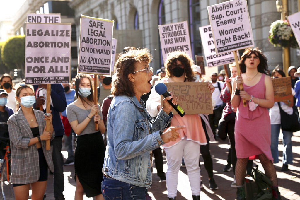Gloria La Riva speaks during a protest in reaction to a leaked Supreme Court Roe v Wade draft at Powell and Market Streets in San Francisco, on Tuesday, May 3, 2022. (Scott Strazzante/San Francisco Chronicle via AP)