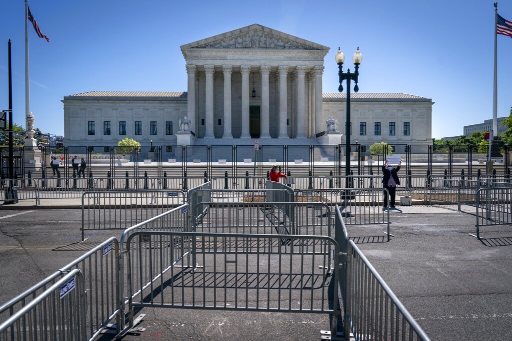 Pens for protesters are set up before anti-scaling fencing that blocks off the stairs to the Supreme Court, Tuesday, May 10, 2022, in Washington. (AP Photo/Jacquelyn Martin)