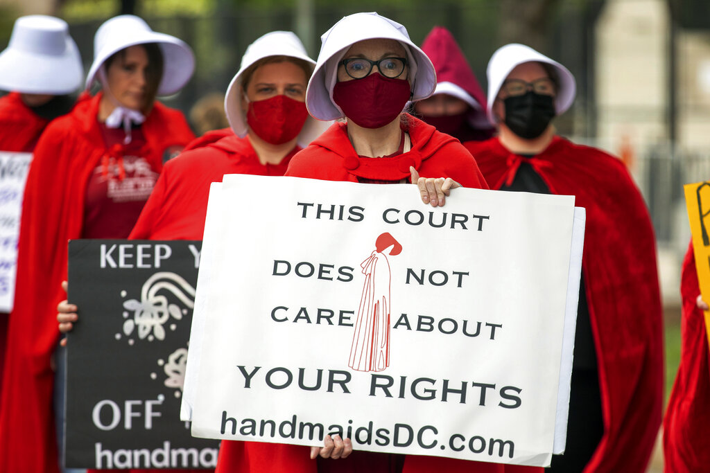 Abortion-rights protesters hold signs during a demonstration outside of the U.S. Supreme Court in Washington, Sunday, May 8, 2022. (AP Photo/Amanda Andrade-Rhoades)