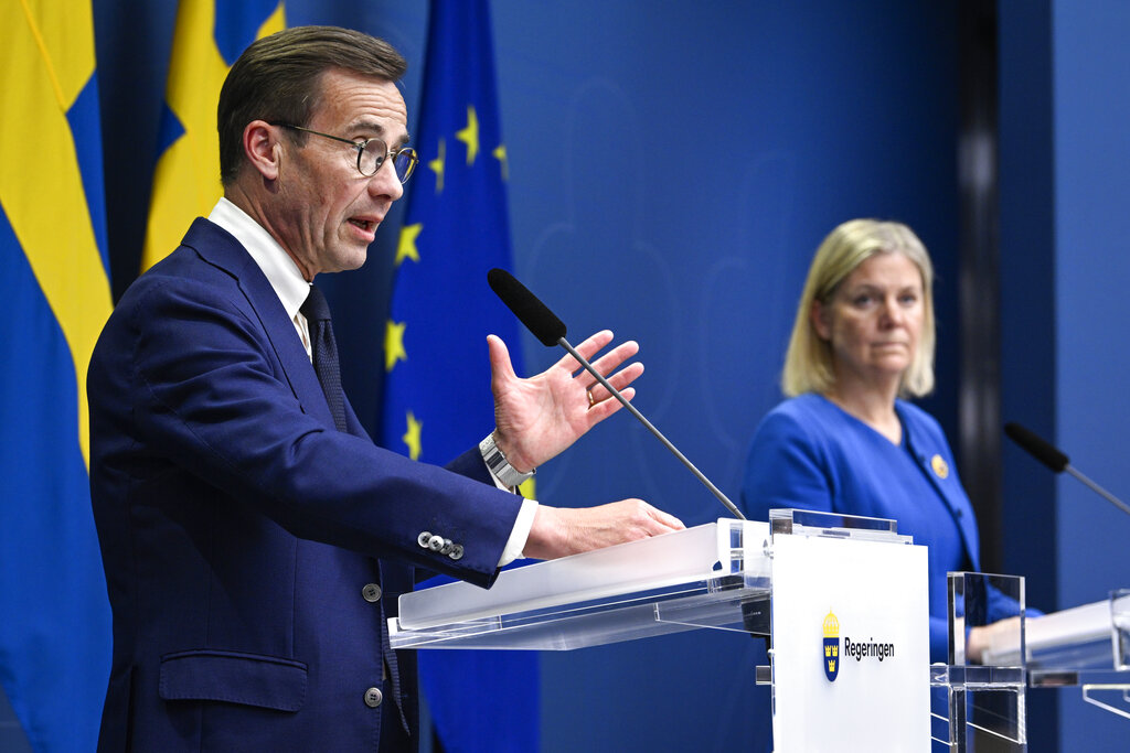 Sweden's Prime Minister Magdalena Andersson, right, and the Moderate Party's leader Ulf Kristersson give a news conference in Stockholm, Sweden, Monday, May 16, 2022. Sweden's government has decided to apply for a NATO membership. (Henrik Montgomery/TT News Agency via AP)
