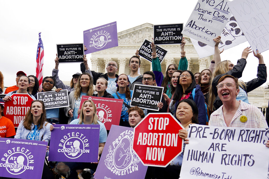 Demonstrators protest outside of the U.S. Supreme Court, Monday, May 16, 2022, in Washington. A draft opinion suggests the U.S. Supreme Court could be poised to overturn the landmark 1973 Roe v. Wade case that legalized abortion nationwide, according to a Politico report released. (AP Photo/Mariam Zuhaib)
