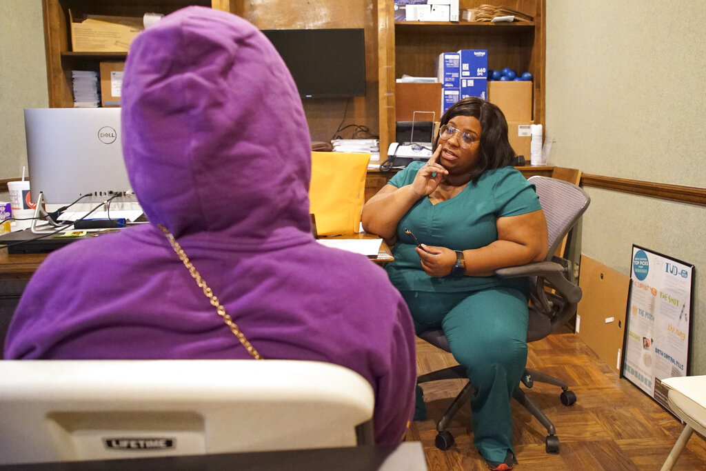 Head nurse Francia Webb talks to a client about abortion options at the West Alabama Women's Center in Tuscaloosa, Ala., on Monday, March 14, 2022. Webb says her experience suffering a miscarriage at five months has given her 