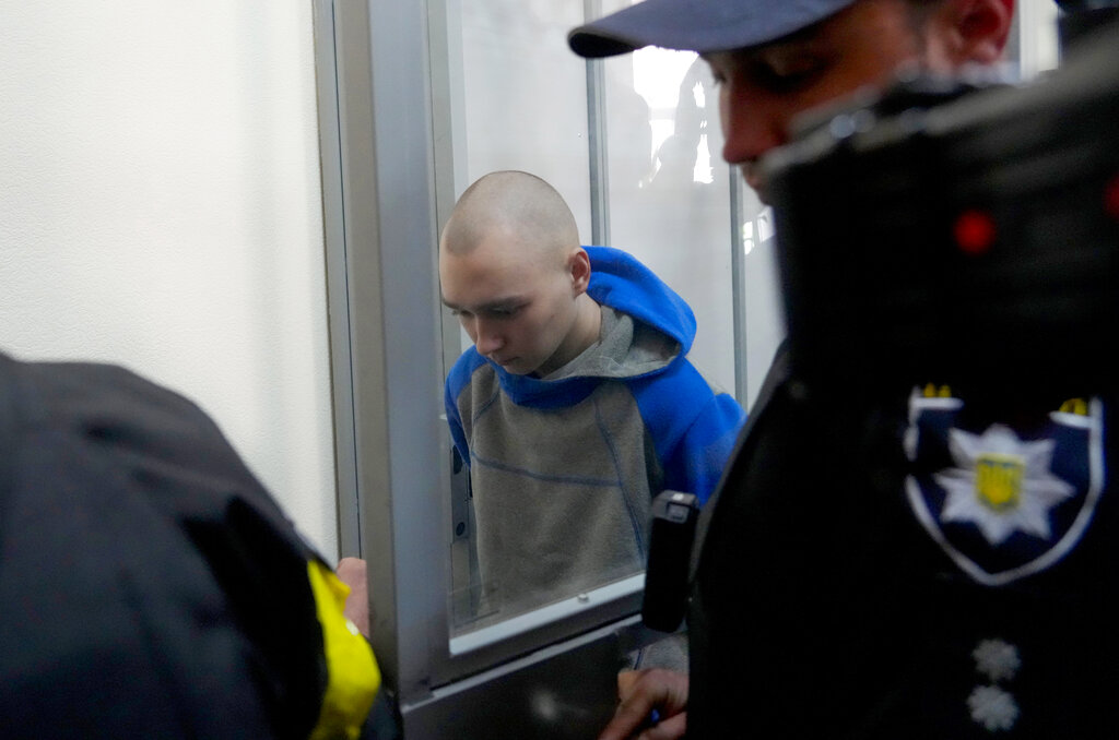 Russian army Sergeant Vadim Shishimarin, 21, arrives for a court hearing in Kyiv, Ukraine, Friday, May 13, 2022. The trial of a Russian soldier accused of killing a Ukrainian civilian opened Friday, the first war crimes trial since Moscow's invasion of its neighbor. (AP Photo/Efrem Lukatsky)