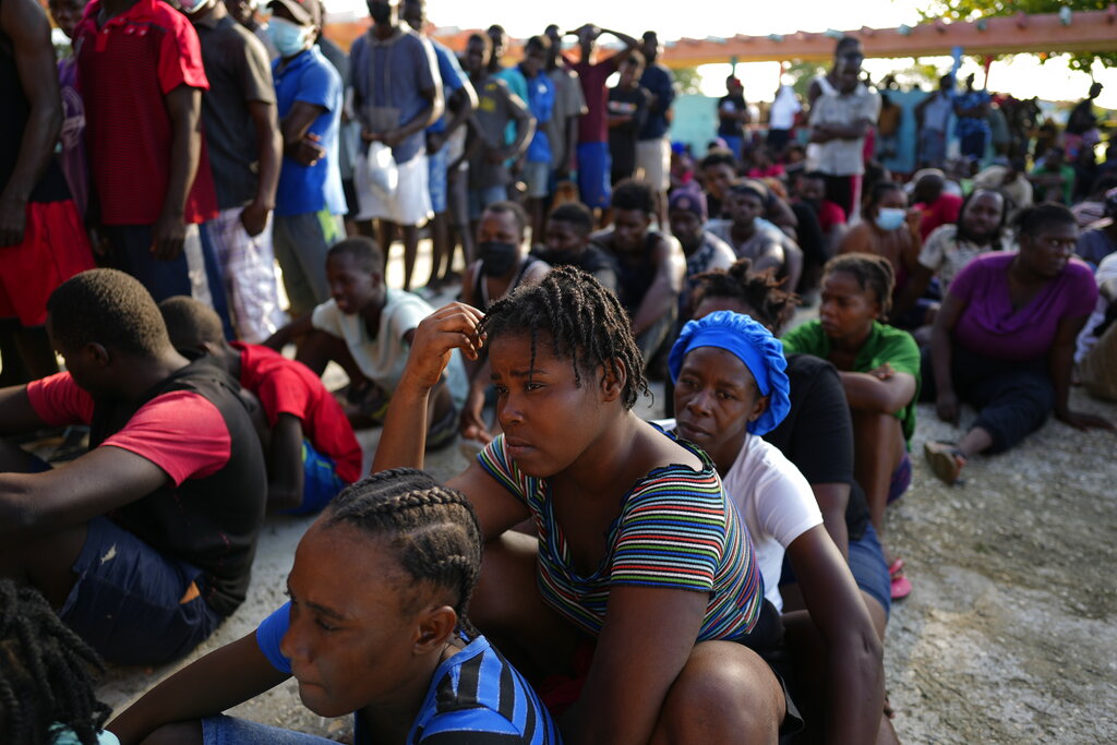 Haitians wait to be processed and receive medical attention at a tourist campground in Sierra Morena, in the Villa Clara province of Cuba, Wednesday, May 25, 2022. A vessel carrying more than 800 Haitians trying to reach the United States wound up instead on the coast of central Cuba, government news media said Wednesday. (AP Photo Ramon Espinosa)