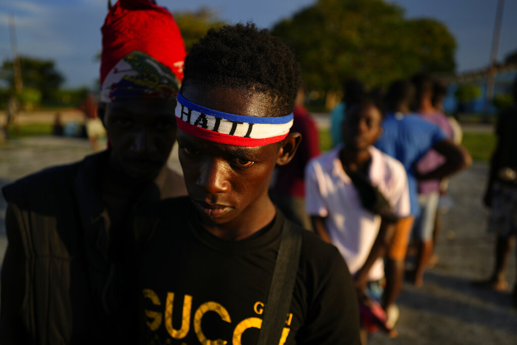 Haitians wait to be processed and receive medical attention at a tourist campground in Sierra Morena, in the Villa Clara province of Cuba, Wednesday, May 25, 2022. A vessel carrying more than 800 Haitians trying to reach the United States wound up instead on the coast of central Cuba, government news media said Wednesday. (AP Photo Ramon Espinosa)