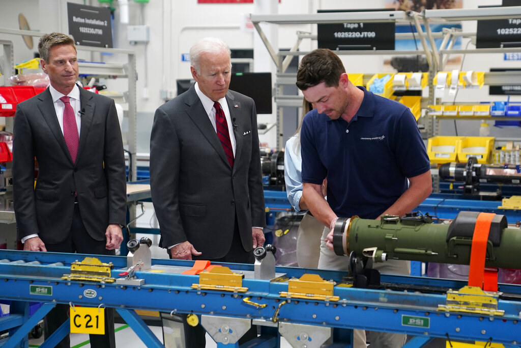 President Joe Biden listens during tour of the Lockheed Martin Pike County Operations facility where Javelin anti-tank missiles are manufactured, Tuesday, May 3, 2022, in Troy, Ala. At left is Lockheed Martin president and CEO Jim Taiclet. (AP Photo/Evan Vucci)