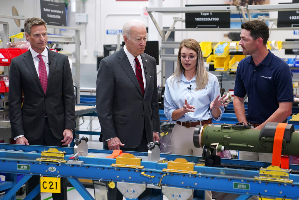 President Joe Biden listens during tour of the Lockheed Martin Pike County Operations facility where Javelin anti-tank missiles are manufactured, Tuesday, May 3, 2022, in Troy, Ala. At left is Lockheed Martin president and CEO Jim Taiclet. (AP Photo/Evan Vucci)