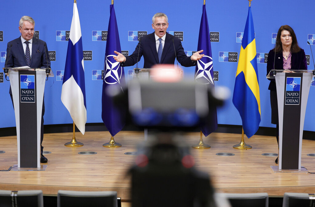 FILE - NATO Secretary General Jens Stoltenberg, center, participates in a media conference with Finland's Foreign Minister Pekka Haavisto, left, and Sweden's Foreign Minister Ann Linde, right, at NATO headquarters in Brussels, Monday, Jan. 24, 2022. Finland and Sweden are nearing decisions on whether to ditch their long-standing policy of military nonalignment and join NATO in the wake of Russia's invasion of Ukraine. Finnish President Sauli Niinisto is expected to announce his stance on NATO membership on Thursday, May 12, 2022. (AP Photo/Olivier Matthys, File)