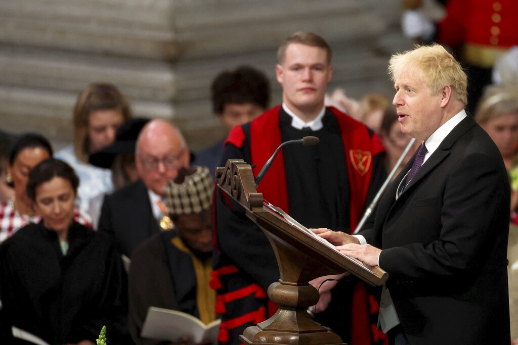 Britain's Prime Minister Boris Johnson gives a reading at the National Service of Thanksgiving held at St Paul's Cathedral as part of celebrations marking the Platinum Jubilee of Britain's Queen Elizabeth II, in London, Friday, June 3, 2022. (Phil Noble/Pool photo via AP)