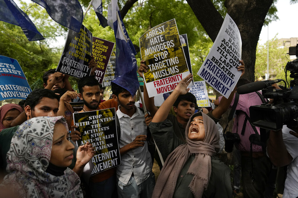 Muslim students shout anti government slogans during a protest outside Uttar Pradesh house, in New Delhi, Monday, June 13, 2022. The students were protesting against persecution of Muslims and recent demolition of their houses following last week's protests against former Bharatiya Janata Party spokesperson Nupur Sharma's remark deemed derogatory to Islam's Prophet Muhammad. (AP Photo/Manish Swarup)