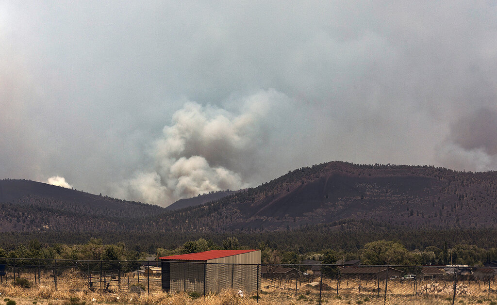 The Haywire Fire burns 7.5 miles northeast of Doney Park on Tuesday, June 14, 2022, in Flagstaff, Ariz.  (Rachel Gibbons/Arizona Daily Sun via AP)