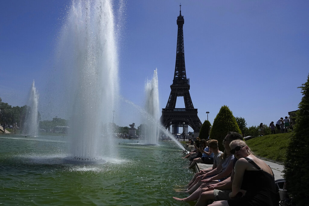 People cool off in the Trocadero fountains, Friday, June 17, 2022 in Paris. Temperatures in France have mounted all week and were expected to hit over 40 C in the southwest on Friday, and in the Paris region Saturday. Unusually for France, nighttime temperatures are also high, and the heat is stretching to normally cooler regions in Brittany and Normandy on the Atlantic Coast. (AP Photo/Michel Euler)