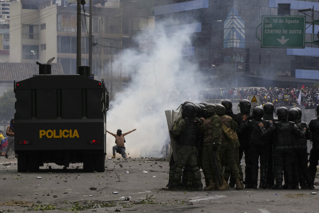 Protesters clash with police during demonstrations against the government of President Guillermo Lasso and rising fuel prices in Quito, Ecuador, Tuesday, June 21, 2022. Ecuador's defense minister warned Tuesday that the country's democracy was at risk as demonstrations turned increasingly violent in the capital. (AP Photo/Dolores Ochoa)