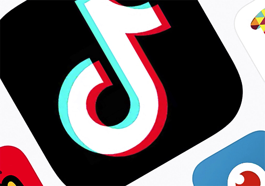 FILE - This Feb. 25, 2020, file photo shows the icon for TikTok in New York. The social media app shared its list of top 100 videos, creators and trends in America in 2020. In action announced Monday, Dec. 14, 2020, federal regulators are ordering Facebook, Twitter, Amazon, TikTok’s parent and five other social media companies to provide detailed information on how they collect and use consumers’ personal data and how their practices affect children and teens. (AP Photo/File)