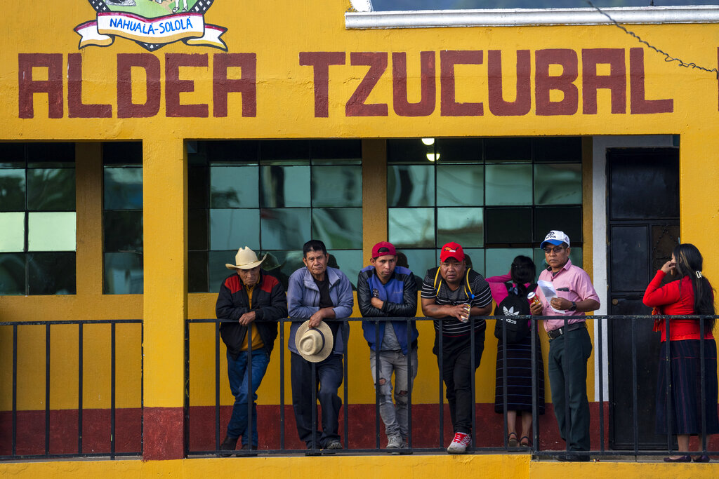 Relatives of Pascual Melvin Guachiac and Wilmer Tulul, attend a community meeting in Tzucubal, Guatemala, Wednesday, June 29, 2022. Tzucubal is the hometown of Pascual Melvin Guachiac and Wilmer Tulul, both 13, who were among the dead discovered inside a tractor-trailer on the edge of San Antonio, Texas, on Monday, in one of the nation's deadliest smuggling episode on the U.S.-Mexico border. (AP Photo/Moises Castillo)